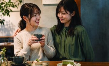 Two women sitting together at a café — Frenemy