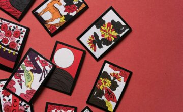 Hanafuda cards with flowers and birds on a red background, Hiragana Times November 2026