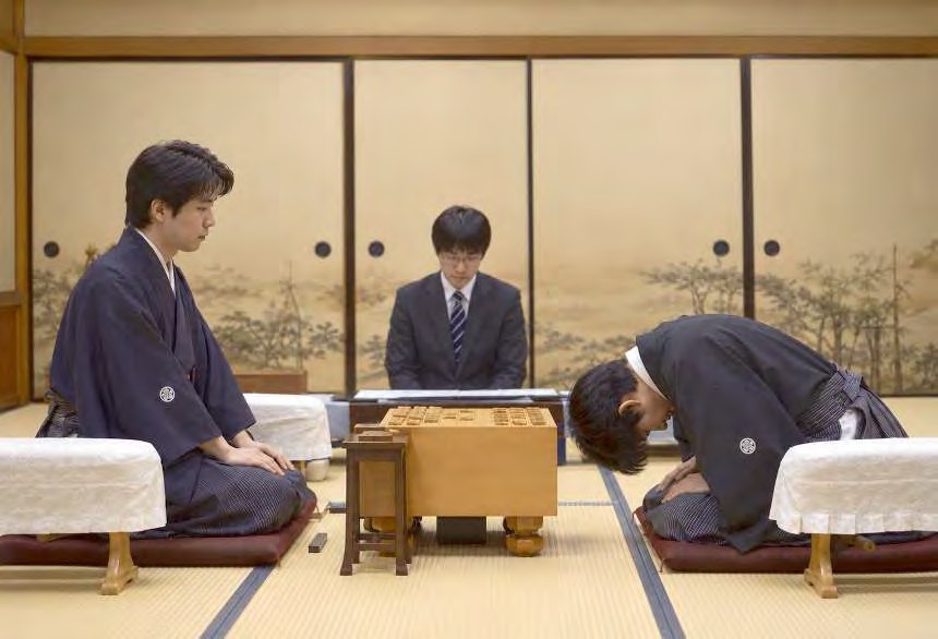 Players bowing at a shogi match